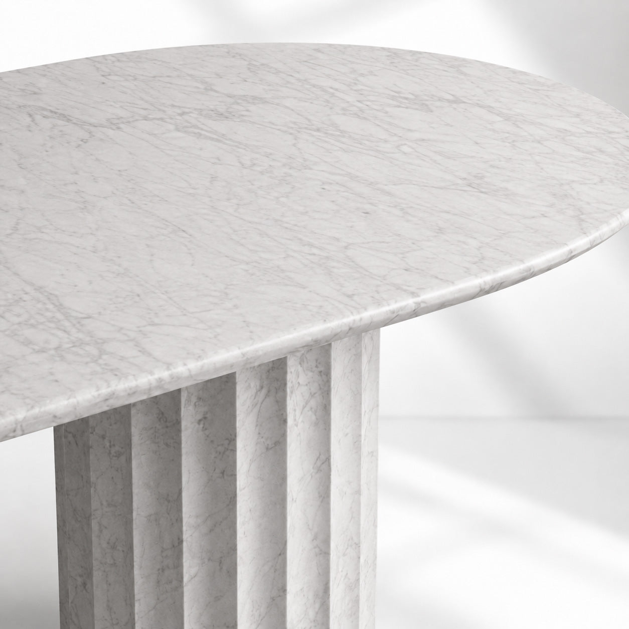 Danae Oval Marble Dining Table with Fluted Pedestal Base